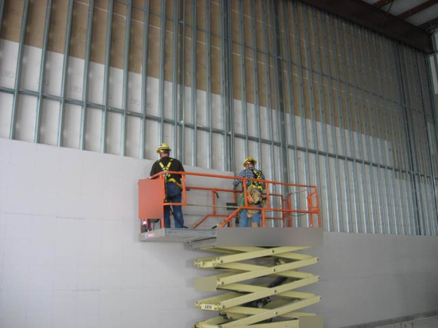Sample photo: tall steel stud wall, half boarded.