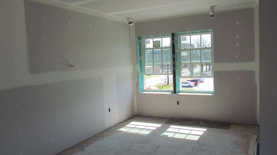 Sample photo: a room hung and taped, in window light.